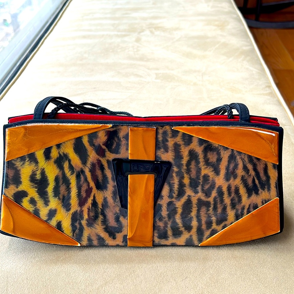 Vintage 90s shiny and dramatic Angela Frascone purse.